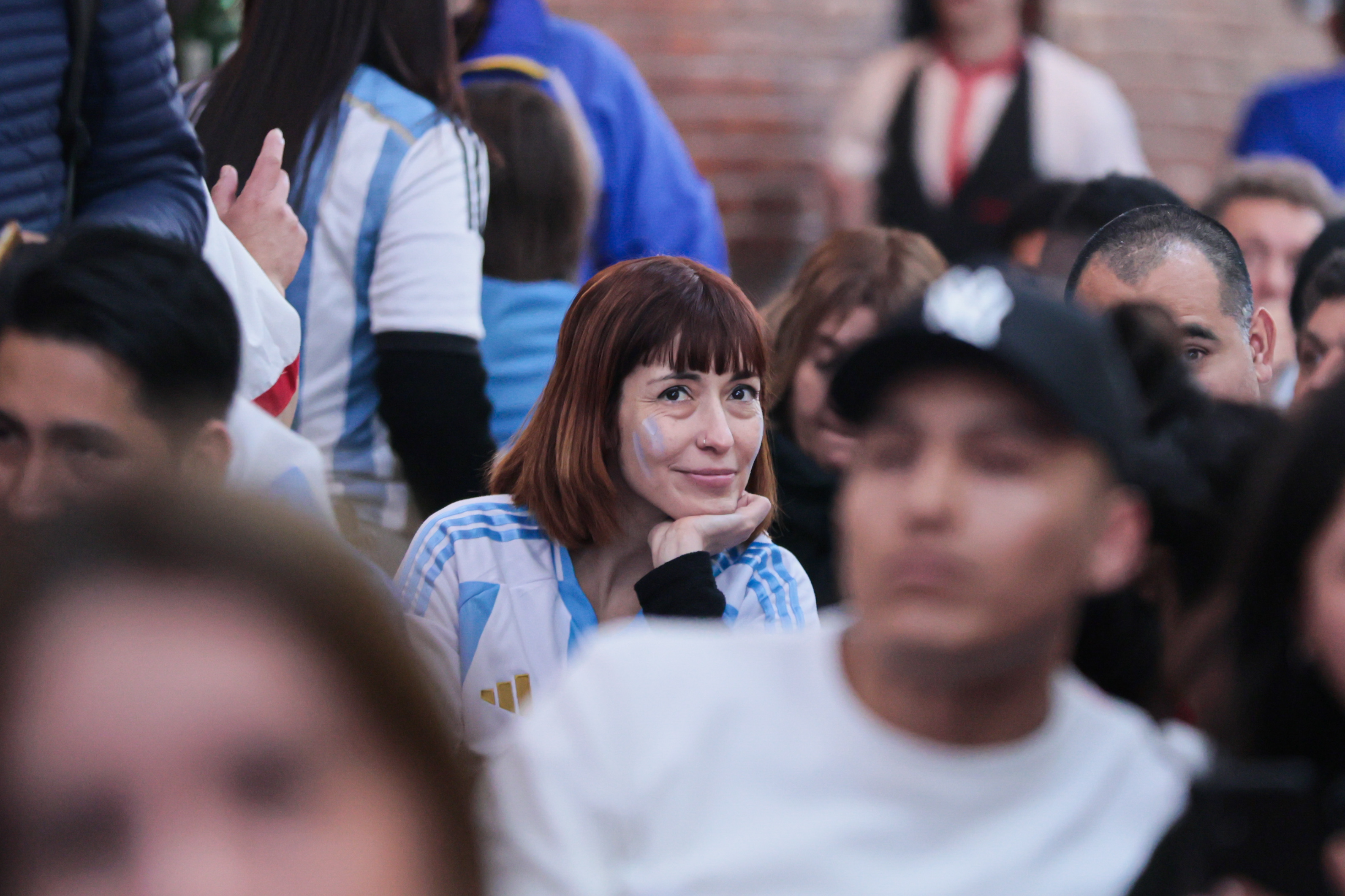 BUENOS AIRES, ARGENTINA - July 14: Fans of the Argentine soccer team watch the match on the scree...