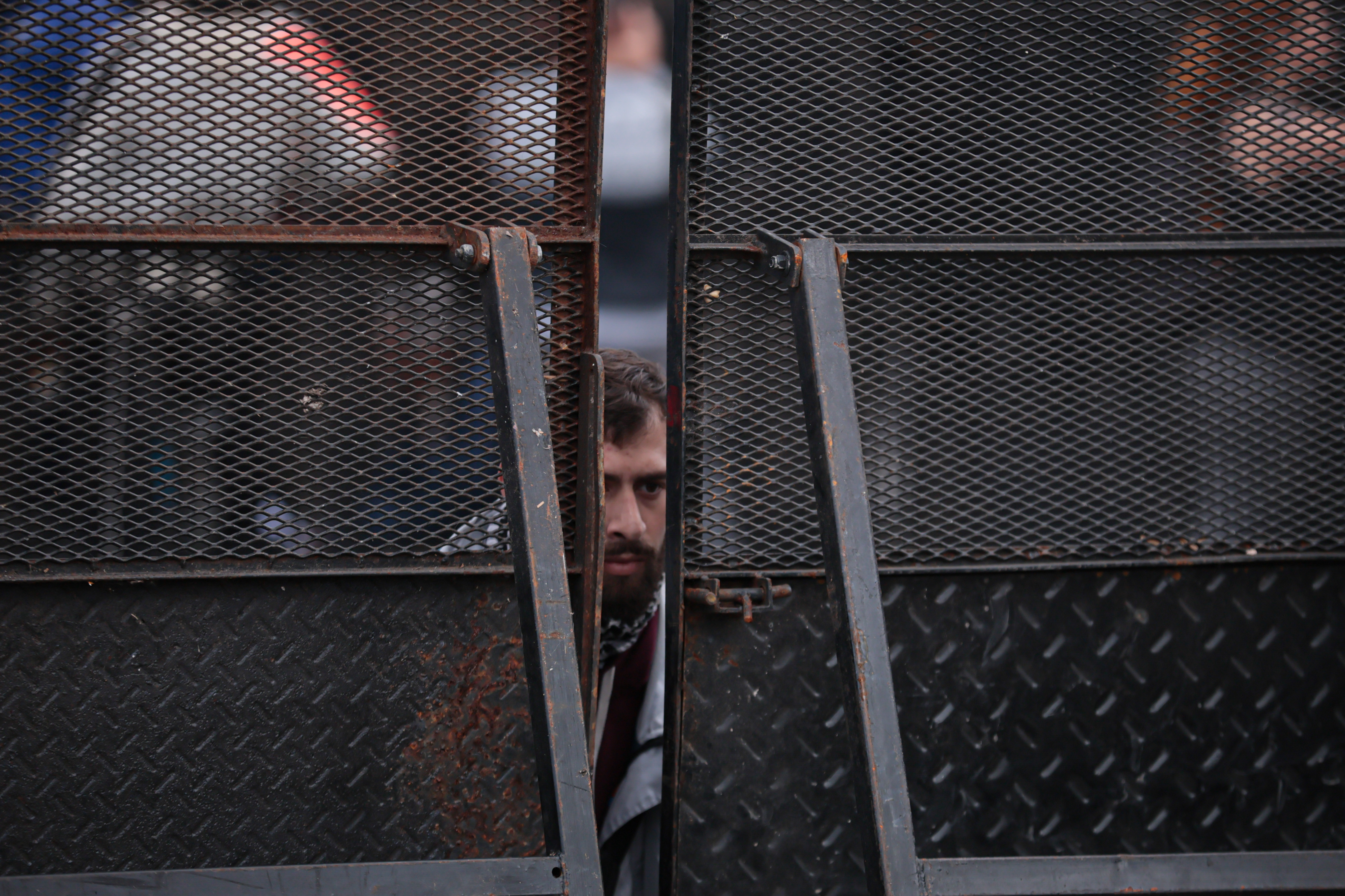 L_C_2679 Buenos Aires, Argentina - September 11, 2024: Police place fences to contain the demonstration in...