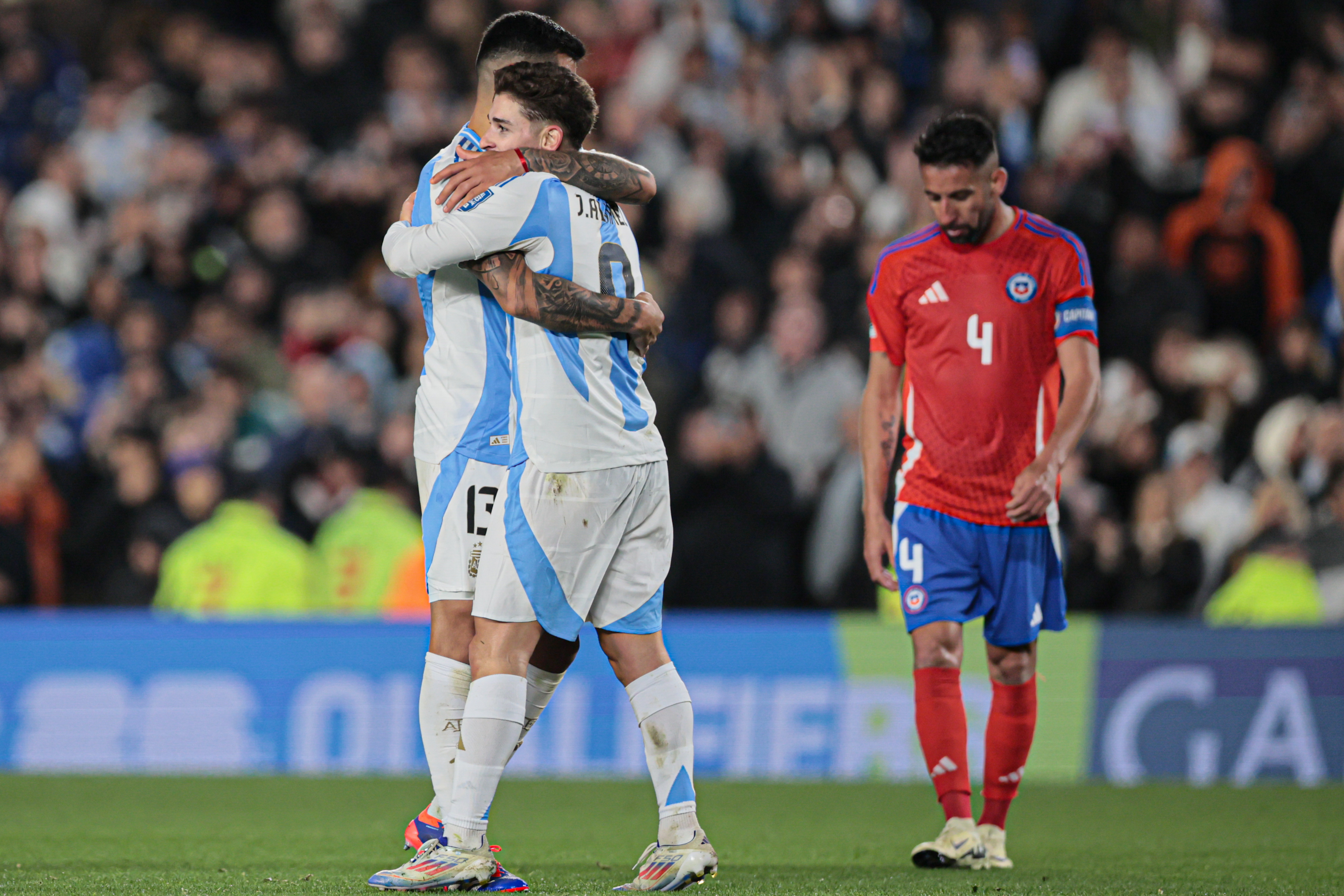 "Argentina vs Chile" 2024 Buenos Aires, Argentina - September 5, 2024. Cristian Romero (left) hugs the scorer of Argentina'...