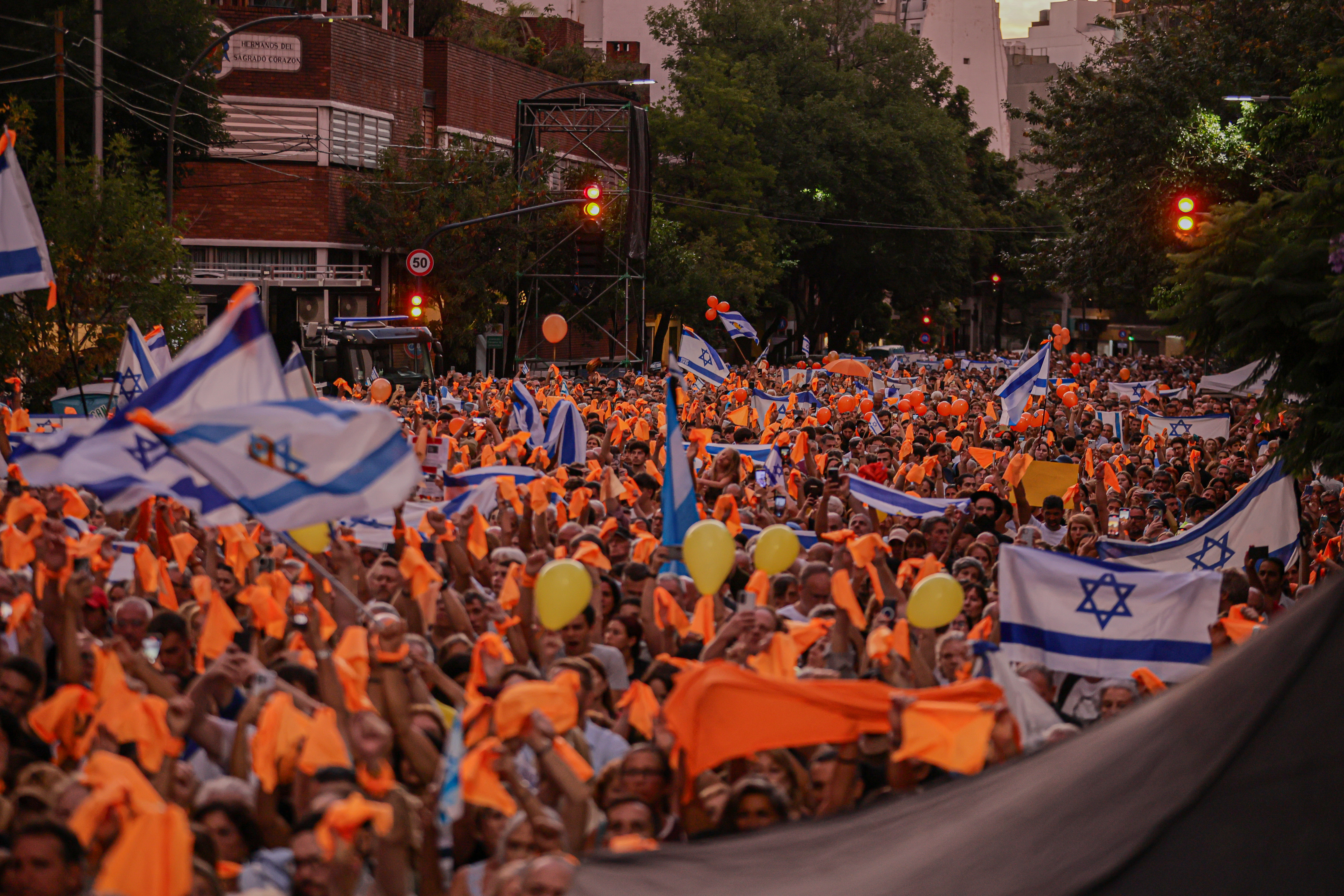 Demonstrators Wave Israeli Flags in Argentina, Calling for Freedom of Captives Buenos Aires, Argentina – February 24, 2025: People hold Israeli flags during a demonstration i...