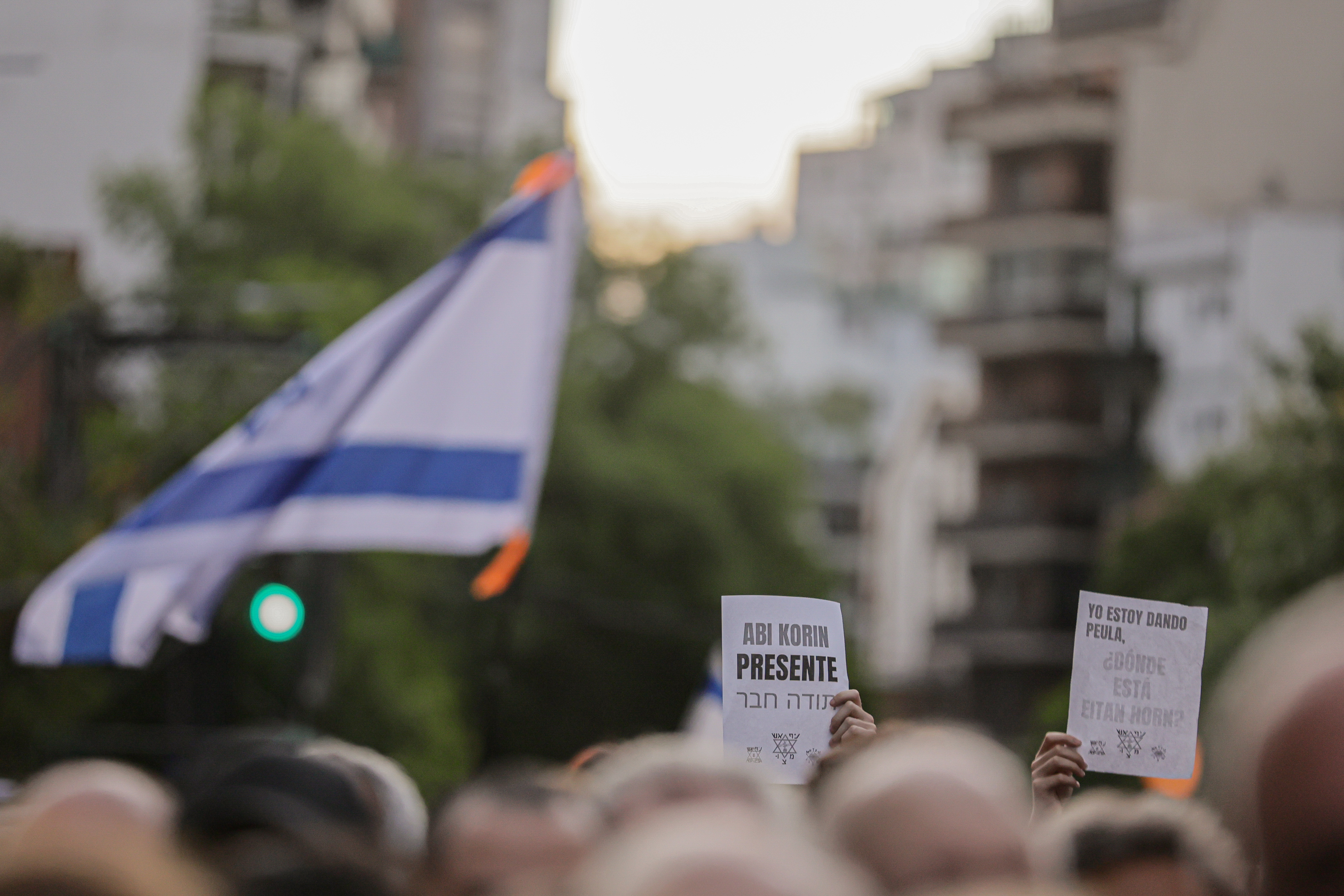 Demonstrators Wave Israeli Flags in Argentina, Calling for Freedom of Captives Buenos Aires, Argentina – February 24, 2025: People hold Israeli flags during a demonstration i...