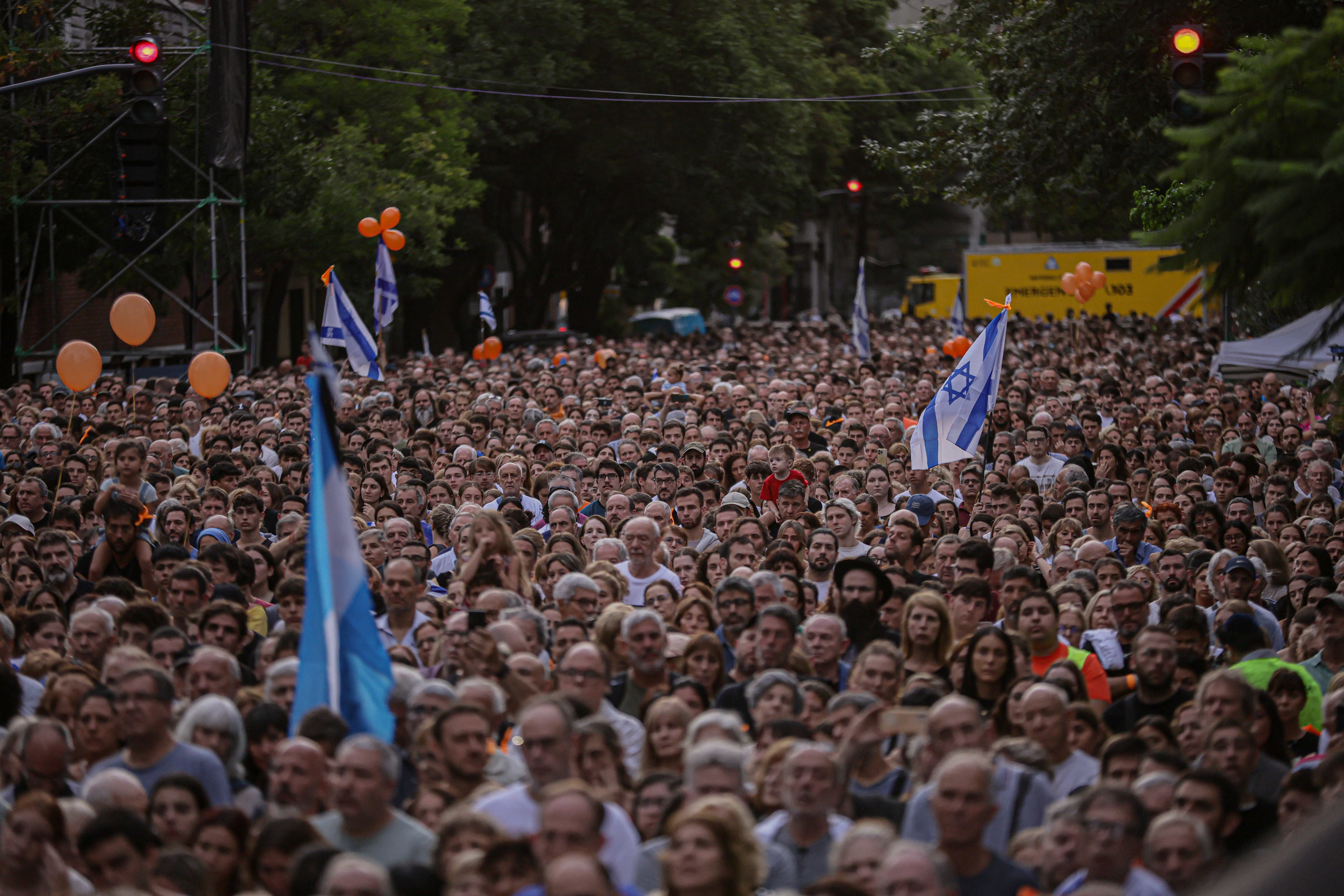 Buenos Aires, Argentina – February 24, 2025: People hold Israeli flags during a demonstration i...