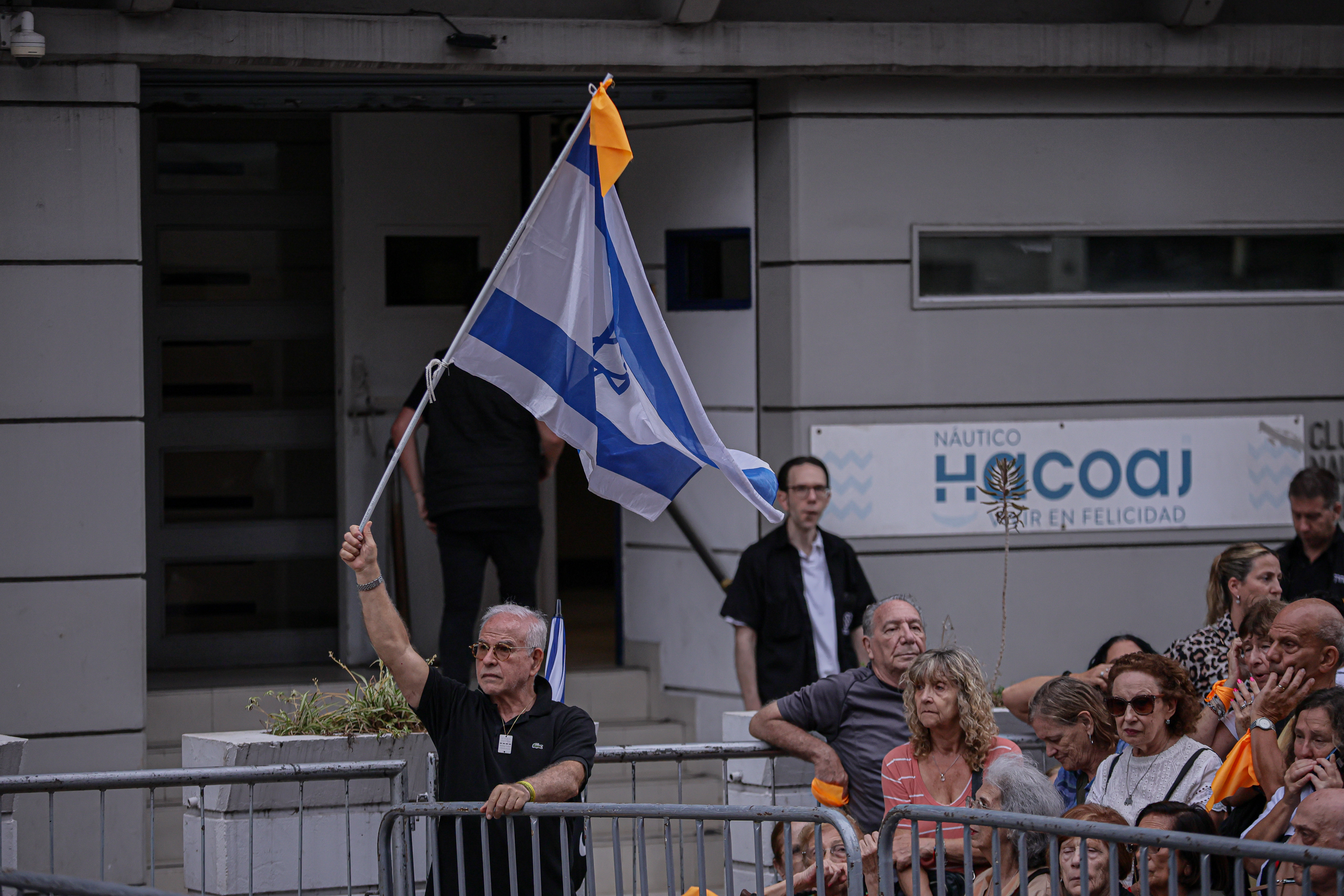 Demonstrators Wave Israeli Flags in Argentina, Calling for Freedom of Captives Buenos Aires, Argentina – February 24, 2025: People hold Israeli flags during a demonstration i...