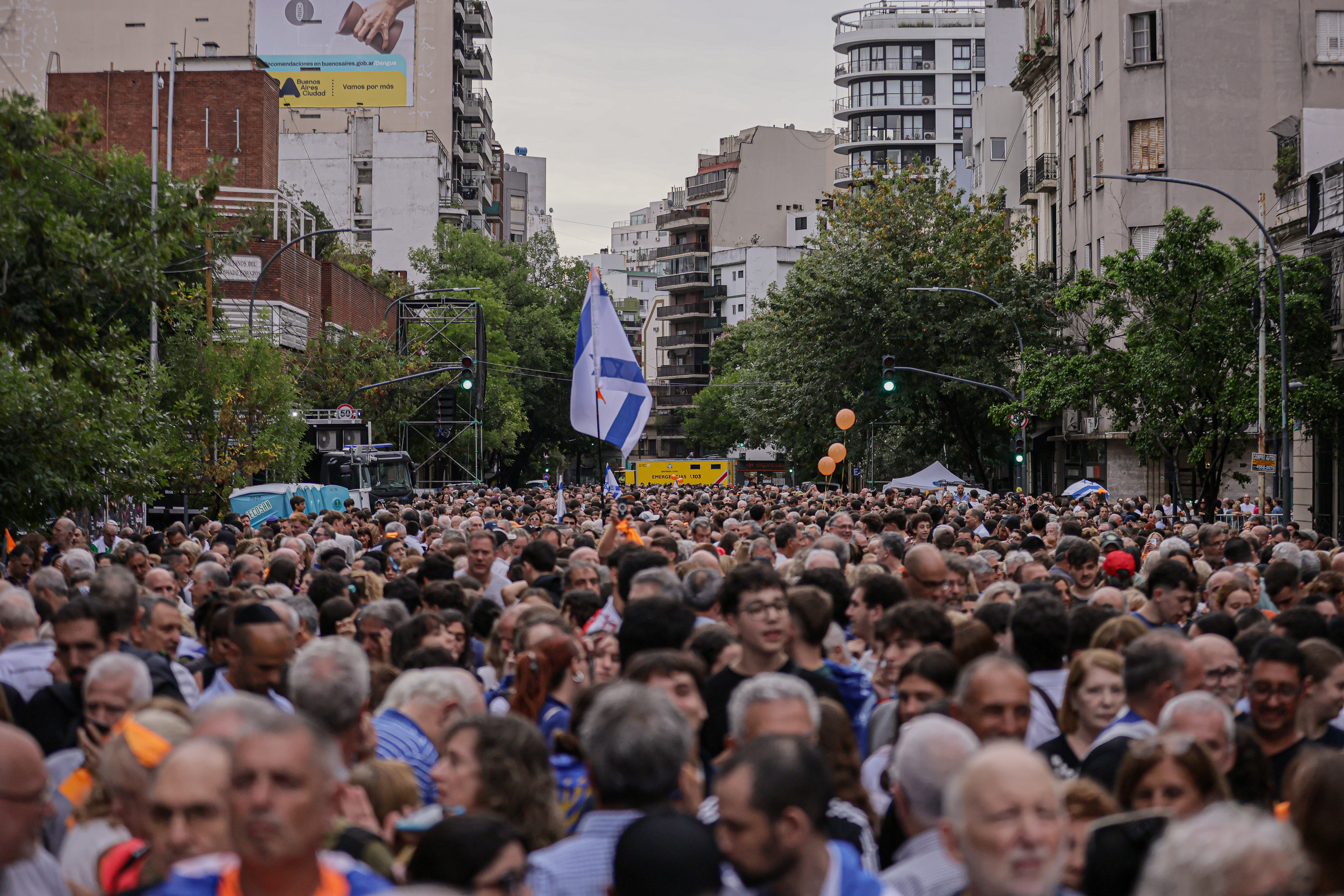 Buenos Aires, Argentina – February 24, 2025: People hold Israeli flags during a demonstration i...