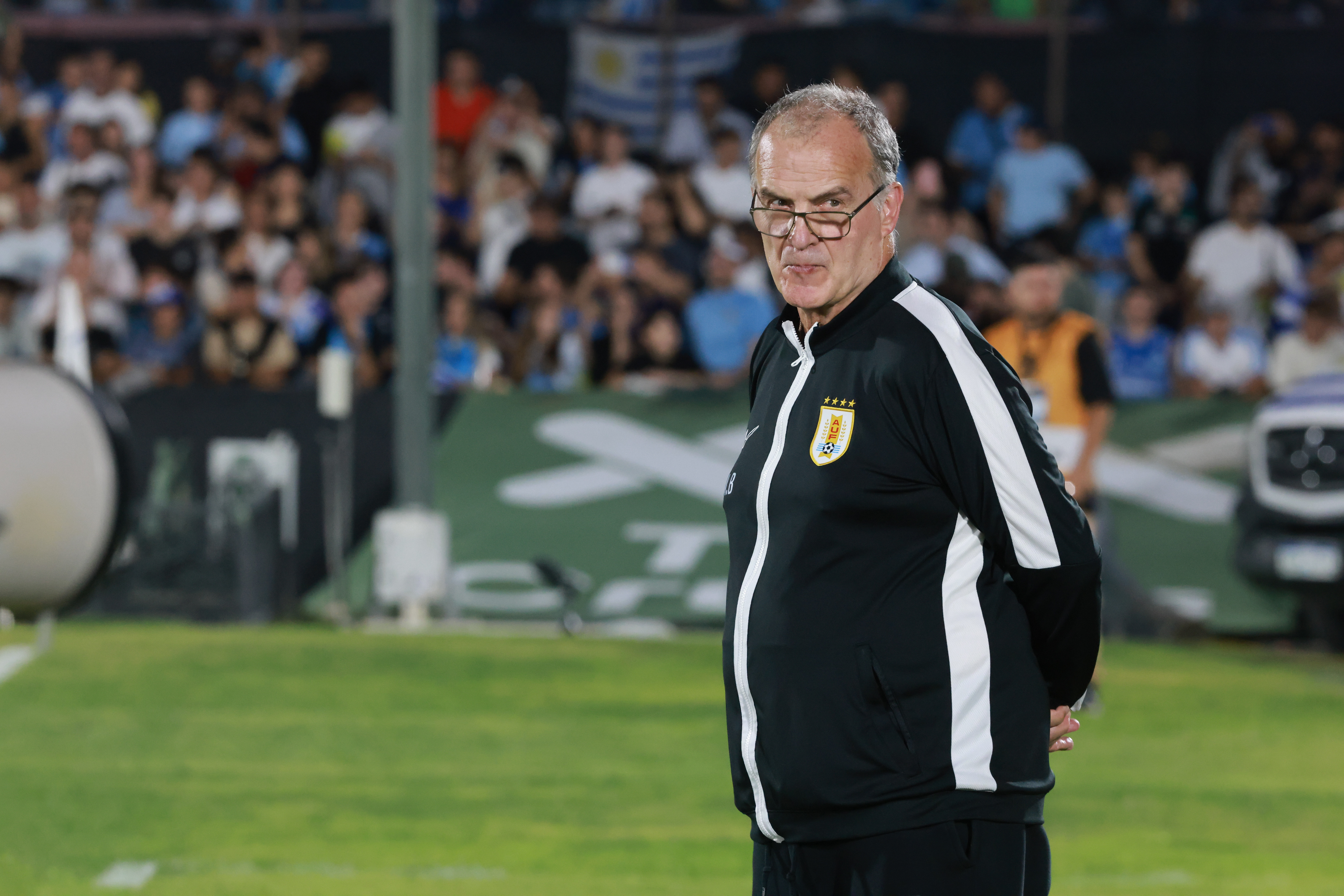 Montevideo, Uruguay – March 21, 2025: Marcelo Bielsa present in the Match. Uruguayan fans await...