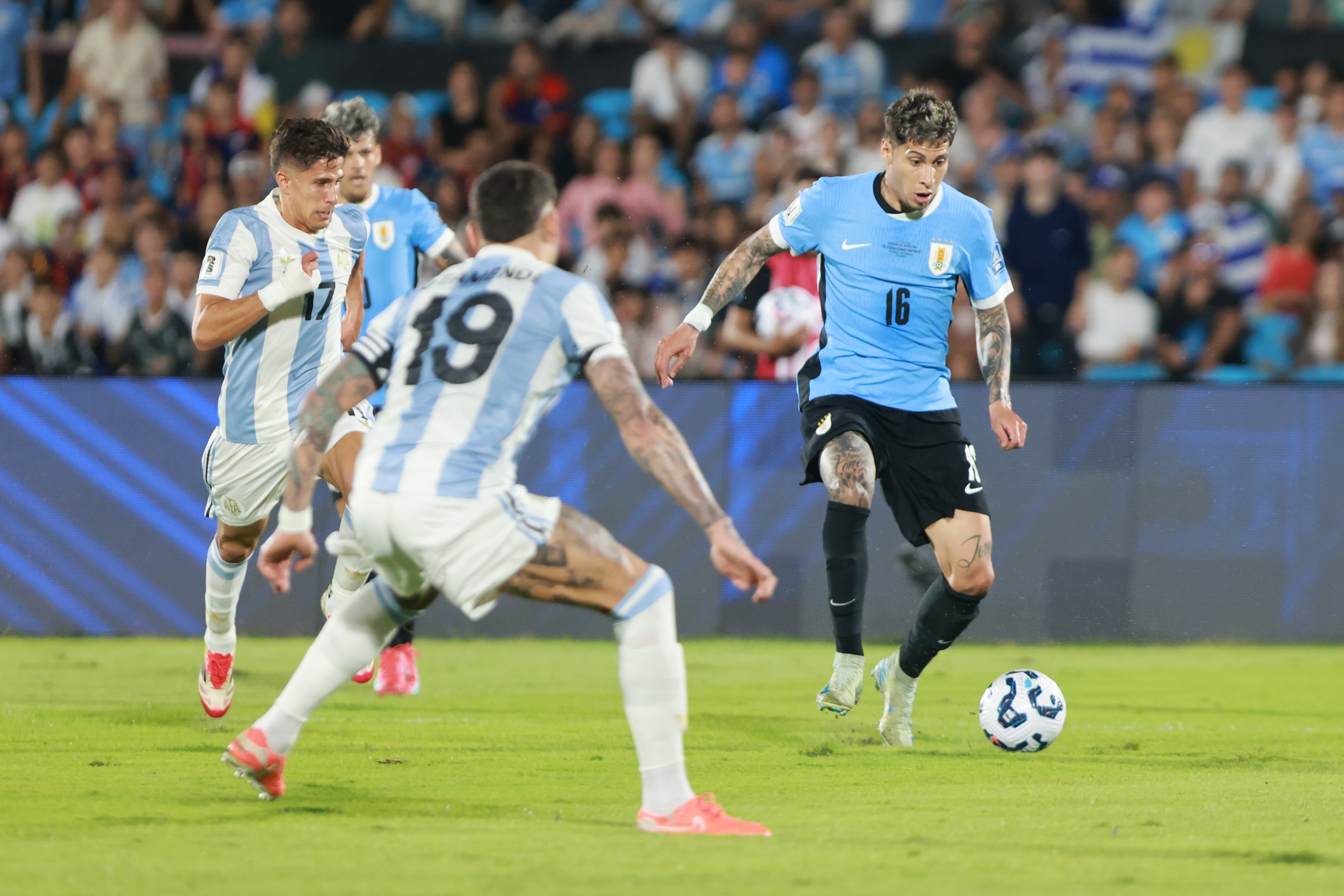 South American Rivals Face Off at Estadio Centenario for Matchday 13 Montevideo, Uruguay – March 21, 2025: Mathias Olivera (R) control a ball against Nicolas Otam...