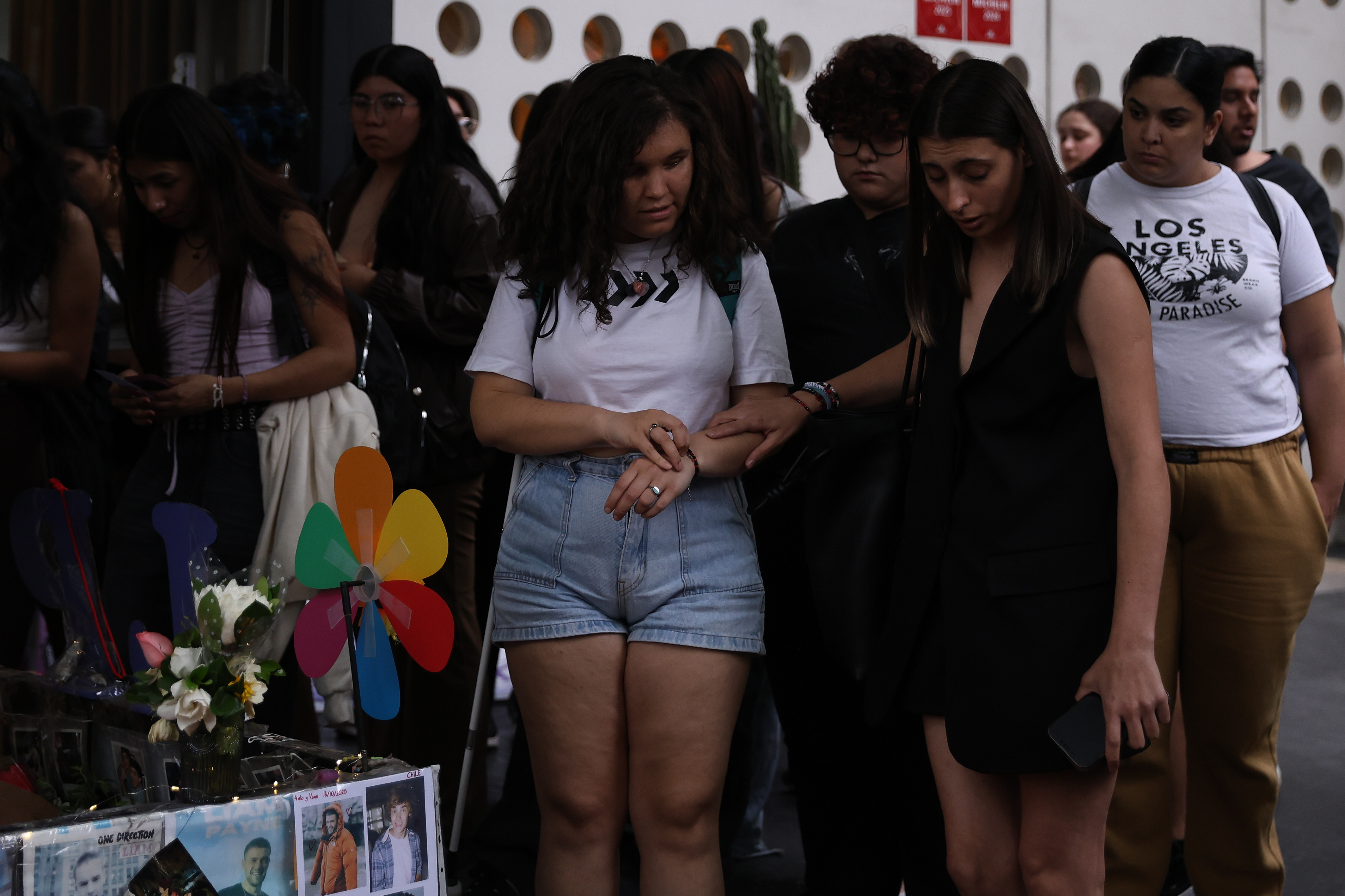 Buenos Aires, Argentina – October 16, 2025: Fans of British singer Liam Payne gathered outside ...