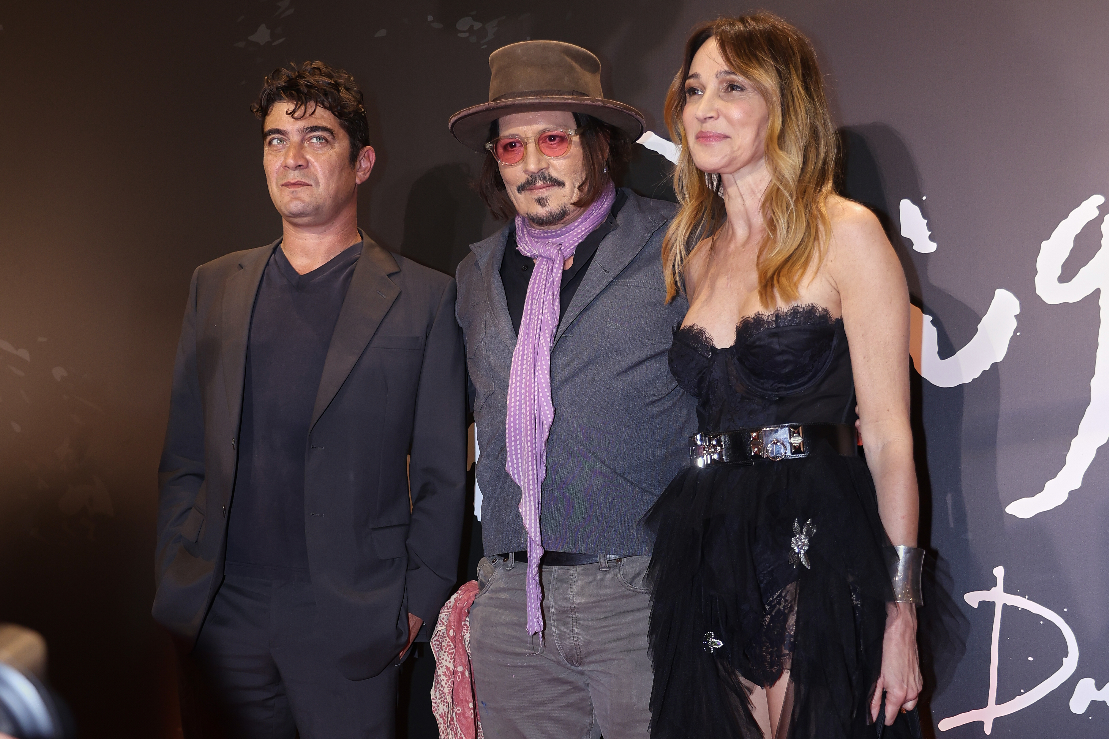 The renowned American actor and director presented his film alongside its star, Riccardo Scamarcio Buenos Aires, Argentina – November 11, 2025: Johnny Depp (C) poses with lead actor Riccardo Sca...