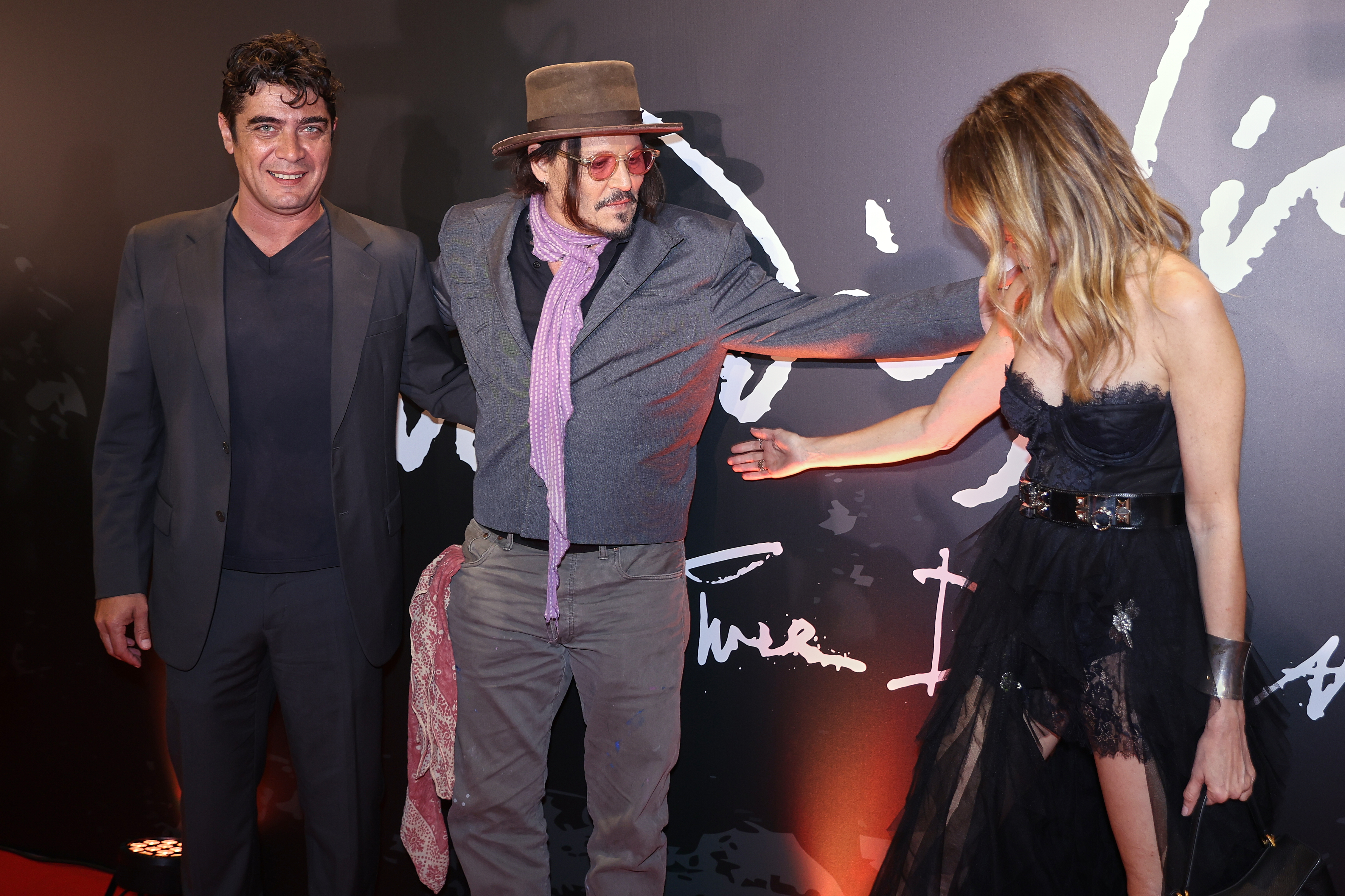 The renowned American actor and director presented his film alongside its star, Riccardo Scamarcio Buenos Aires, Argentina – November 11, 2025: Johnny Depp (C) poses with lead actor Riccardo Sca...