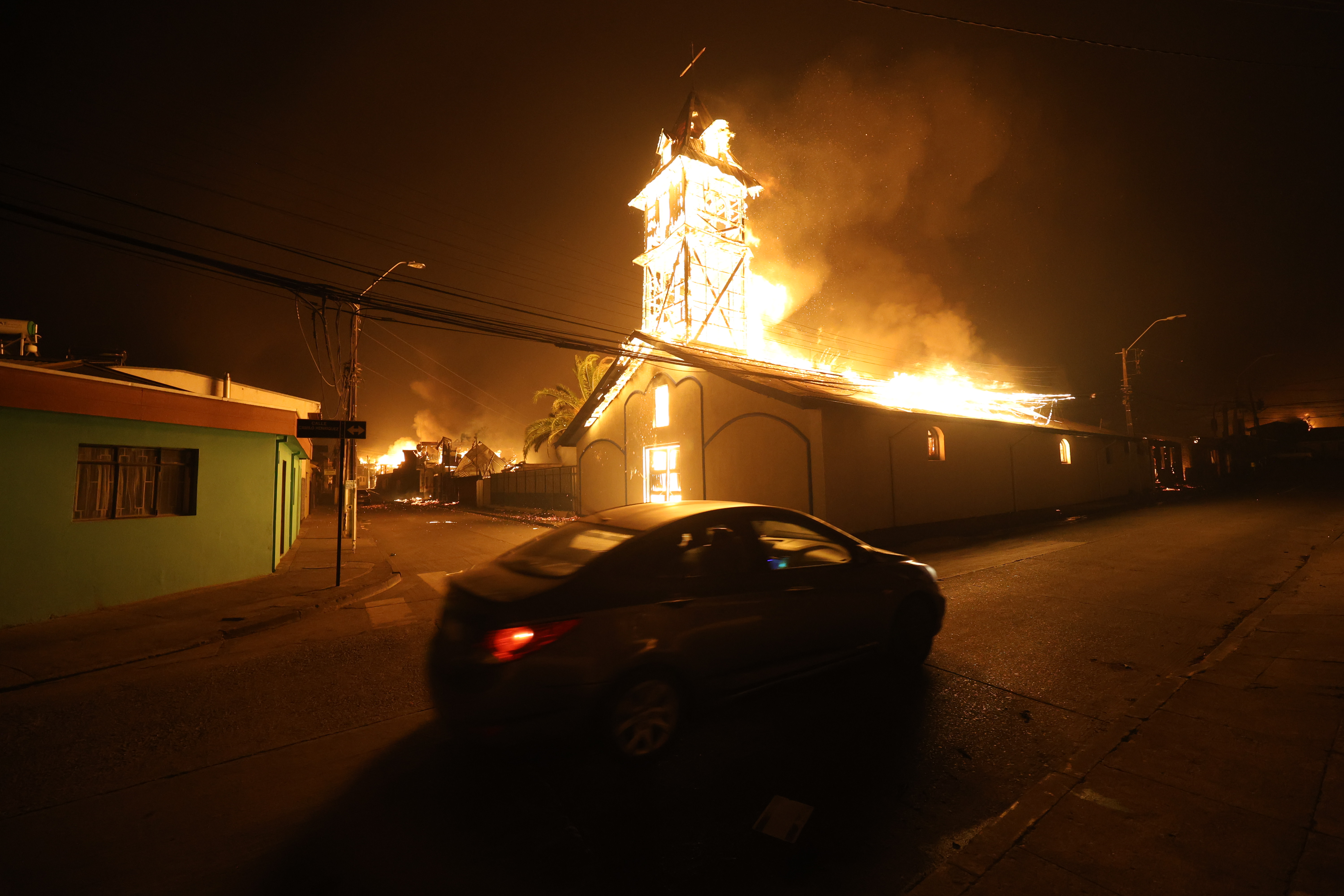 Fire advanced uncontrollably into urban areas of Penco and Lirquén driven by strong winds overnight Concepción, Chile – January 18, 2026: A church burns after being engulfed by a wildfire in the...