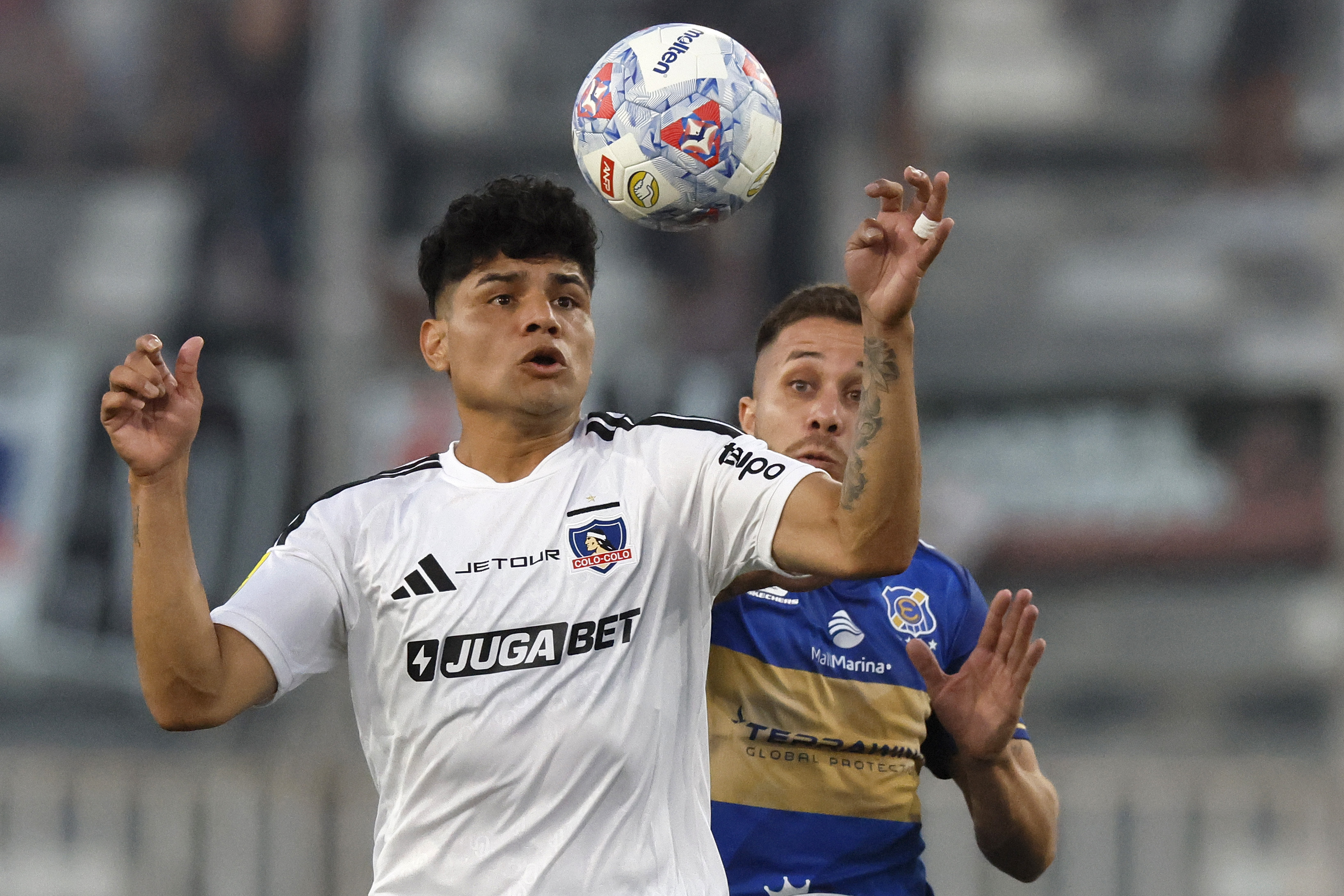 The "Cacique" earned its first three points after a 2-0 win with goals from Javier Correa and Carlos Palacios in Macul Santiago, Chile – February 8, 2026: Colo Colo’s player Claudio Aquino, left, vies for the bal...