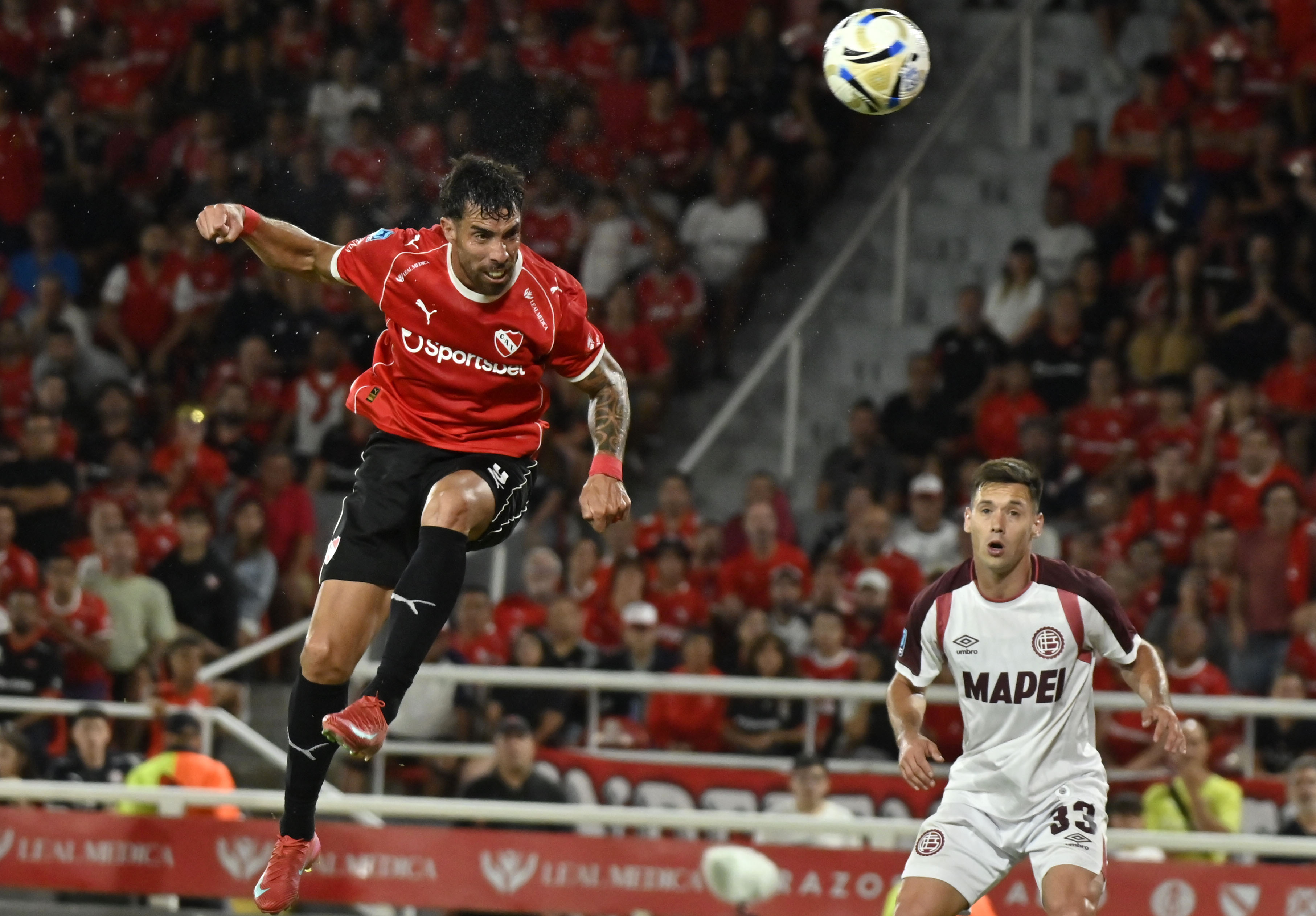 The "Rojo" faces the "Granate" for round 5 of the Apertura Tournament seeking a vital victory in Avellaneda Avellaneda, Argentina – February 13, 2026: Independiente striker Gabriel Avalos hits his head t...