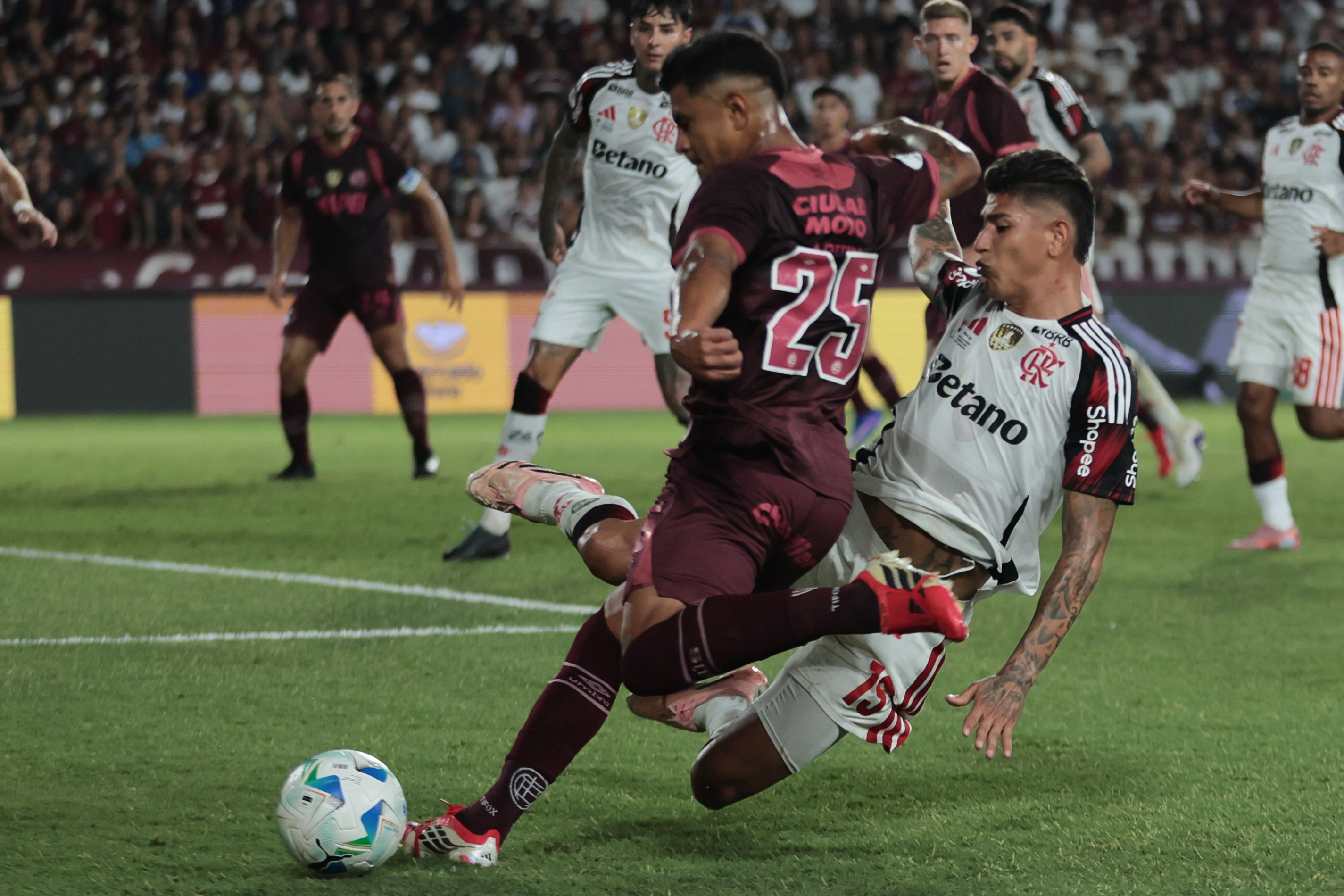 Lanus, Argentina – February 19, 2026: Dylan Aquino (L) of Lanus against Jorge Carrascal (R) of ...